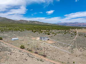 Bird's eye view featuring a rural view, a mountain view, and a desert view