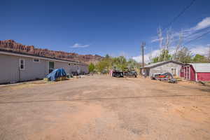 View of yard featuring an outdoor structure and a mountain view