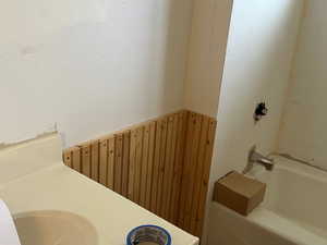 Full bath with walk in shower and a bathing tub