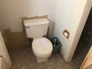 Bathroom featuring toilet and tile patterned floors