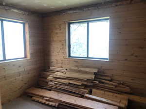 Misc room featuring wood walls