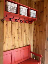 Mudroom with wooden walls
