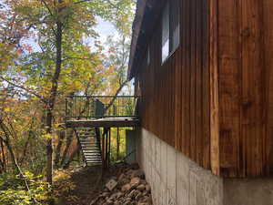 View of home's exterior with stairway