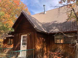 View of home's exterior featuring metal roof