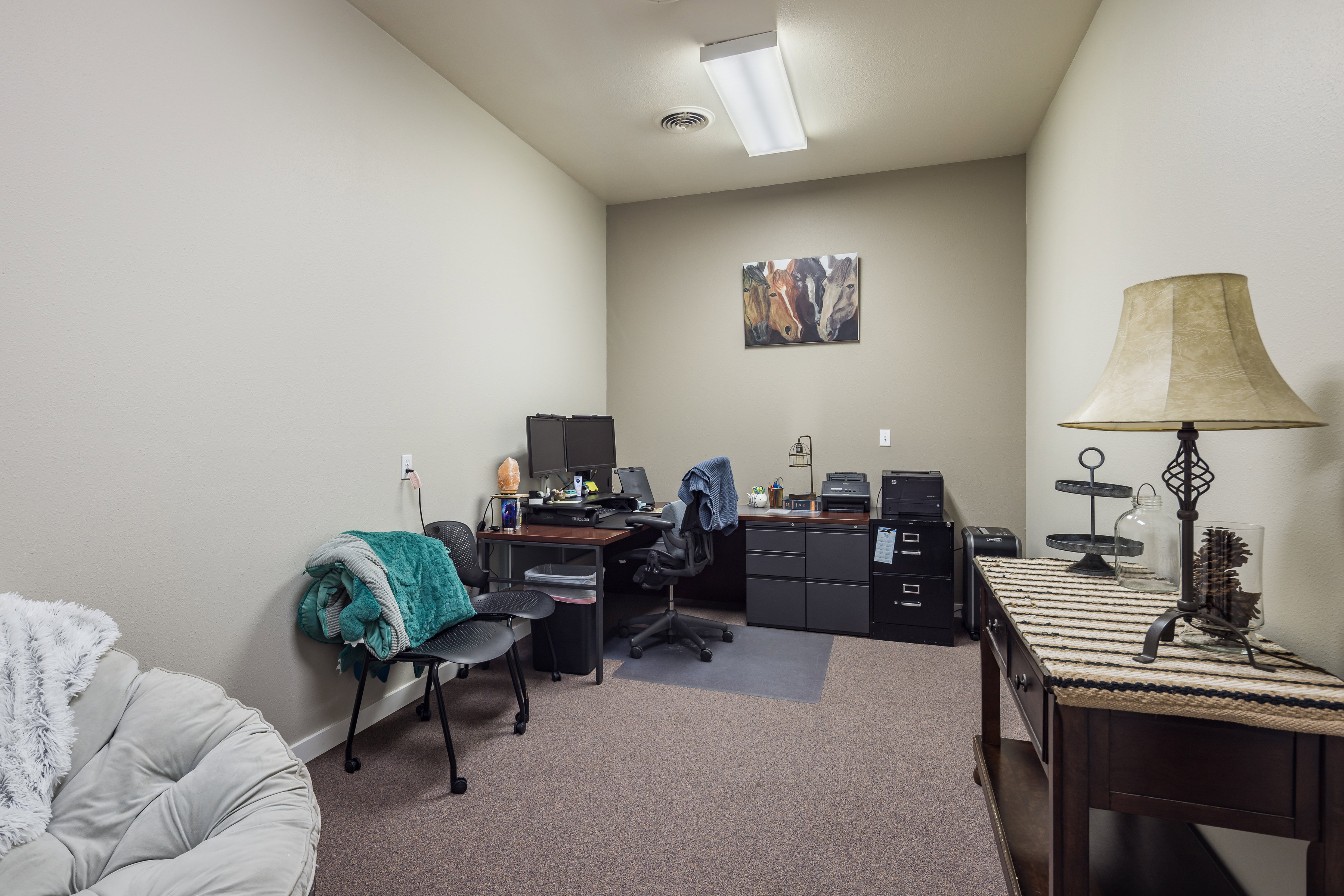 Carpeted office with visible vents