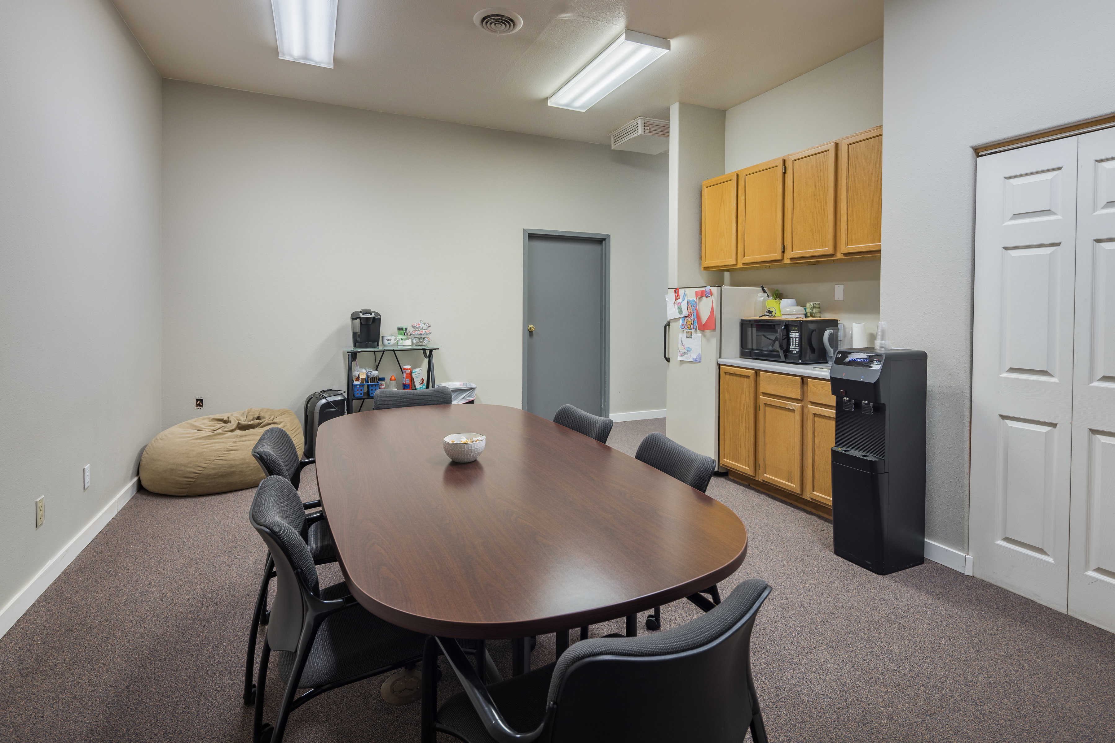 Dining room featuring carpet floors, visible vents, and baseboards