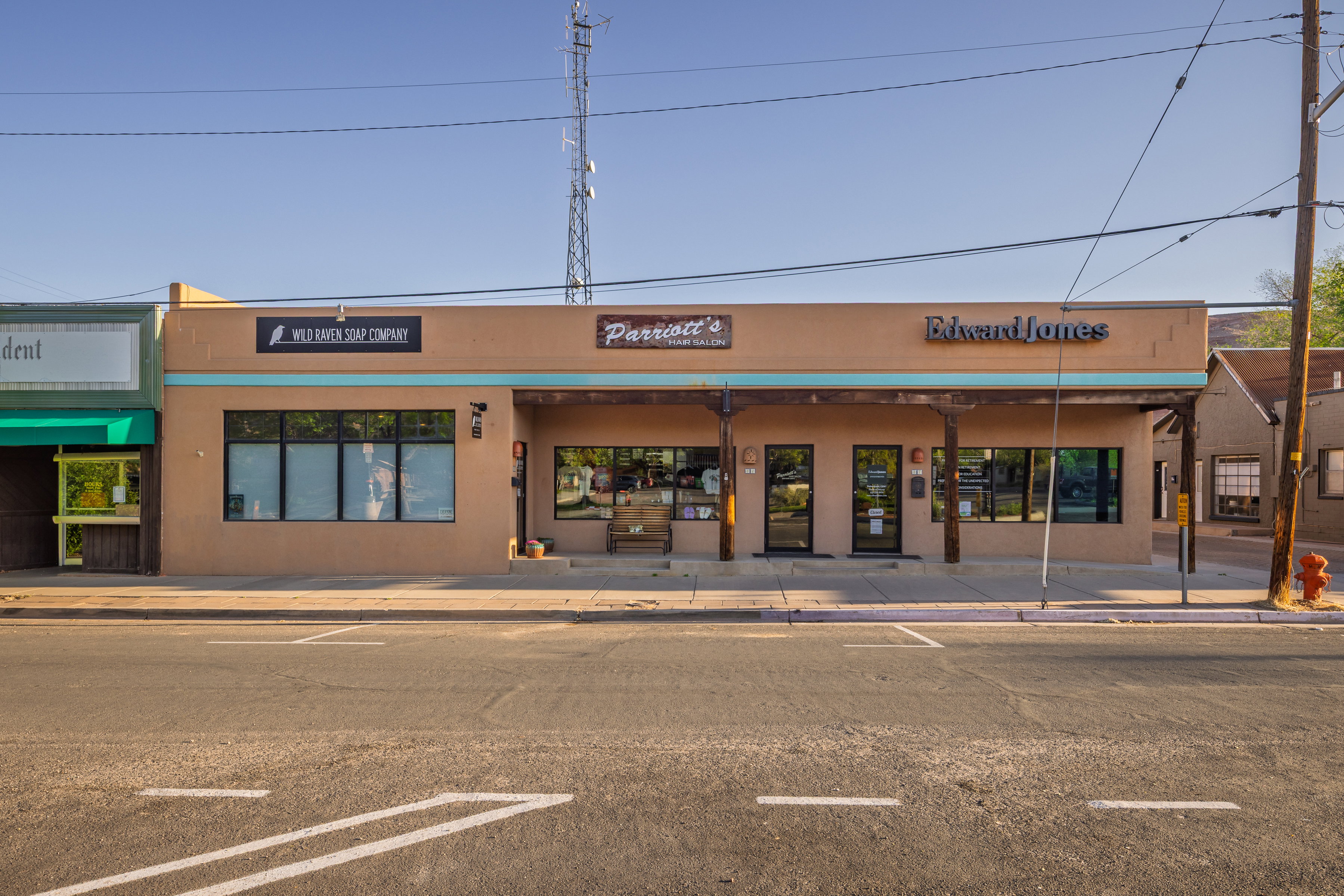 View of building exterior with uncovered parking