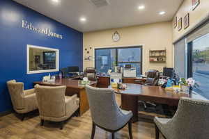 Office space featuring wood finished floors, visible vents, and recessed lighting
