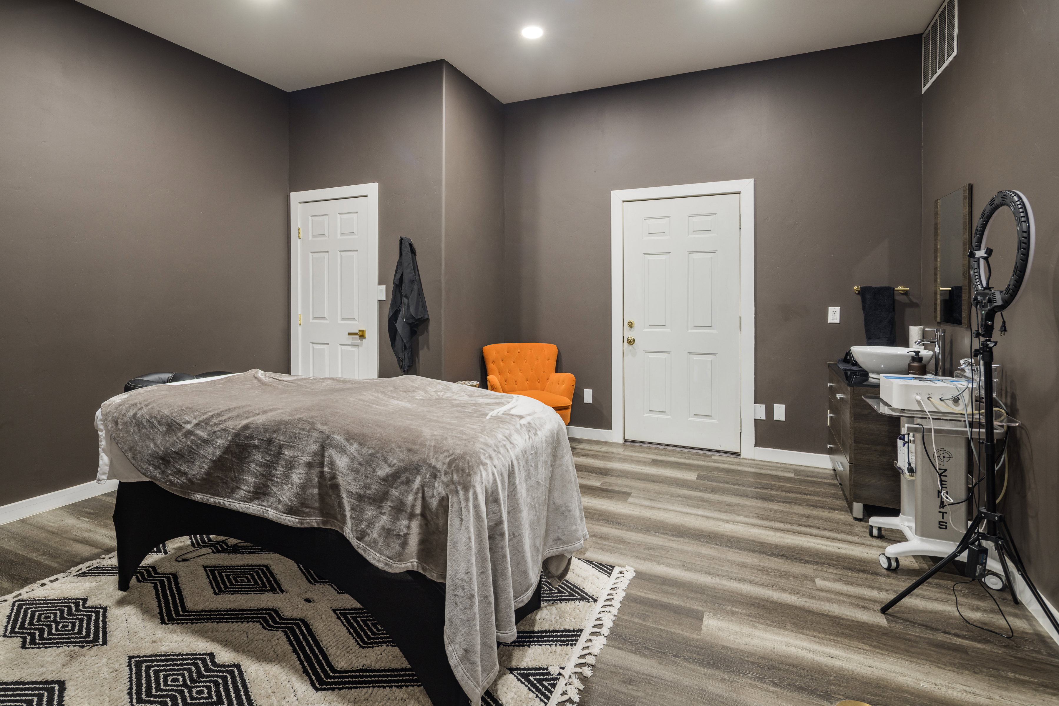 Bedroom with wood finished floors, visible vents, and baseboards