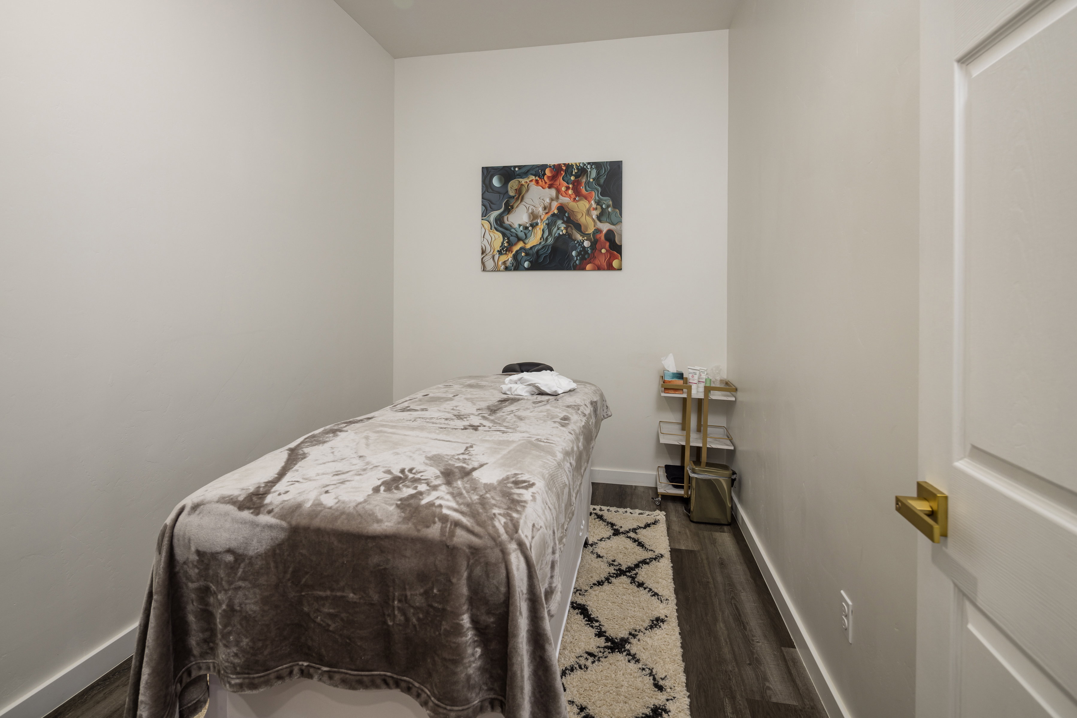 Bedroom with baseboards and wood finished floors