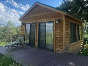 Rear view of house with a deck