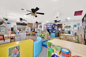 Game room featuring ceiling fan and visible vents
