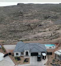 Birds eye view of property with a mountain view