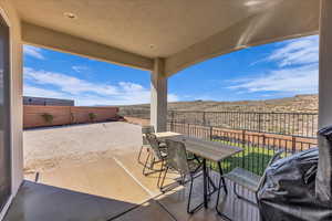 View of patio / terrace featuring a fenced backyard, outdoor dining space, and a grill