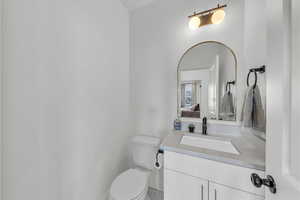 Ensuite bathroom with vanity, toilet, and ensuite bath
