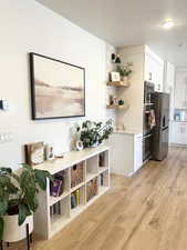 Interior space with a textured ceiling and light wood finished floors