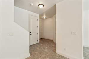 Hall featuring baseboards