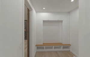 Mudroom with recessed lighting, baseboards, and light wood-style floors