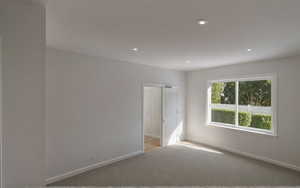 Empty room featuring baseboards, recessed lighting, and carpet floors