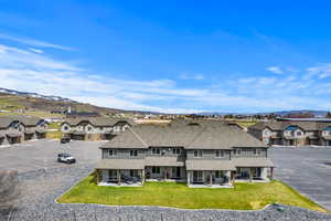 Back patio space includes chairs and barbecue grill