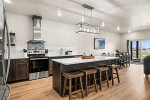 Kitchen with stainless steel appliances and LVP flooring