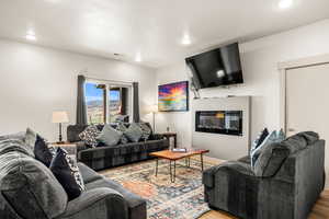 Living room featuring an above the fireplace TV