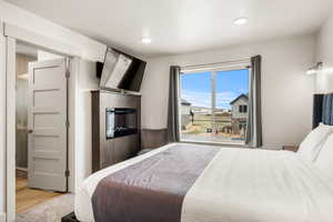Bedroom 2 with fireplace and TV
