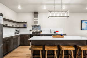 Kitchen featuring a kitchen island that comfortable seats 4