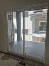 Doorway featuring baseboards