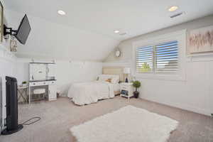 Carpeted bedroom featuring recessed lighting, visible vents, and vaulted ceiling