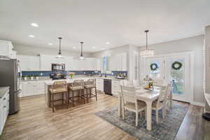 Dining room featuring recessed lighting and light wood finished floors