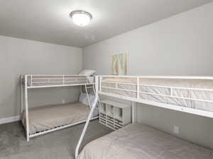 Bedroom with baseboards and carpet floors