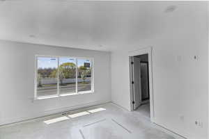 Unfurnished room featuring baseboards