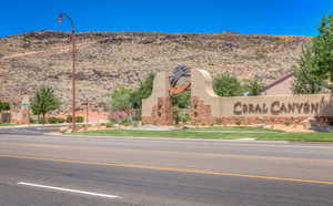 Community / neighborhood sign featuring a mountain view