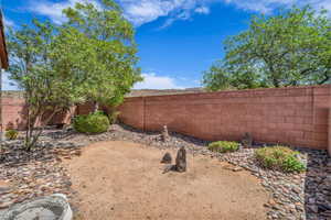 View of yard with a fenced backyard and central air condition unit