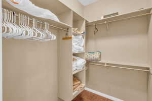 Walk in closet with tile patterned flooring