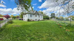 View of yard with a fenced backyard