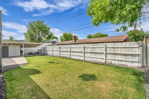 View of yard featuring a patio area and a fenced backyard