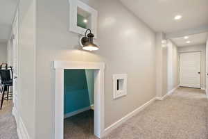 Corridor featuring recessed lighting, baseboards, visible vents, and carpet