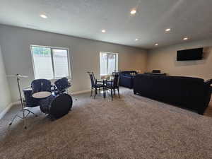 Rec room featuring recessed lighting, carpet flooring, baseboards, and a wealth of natural light