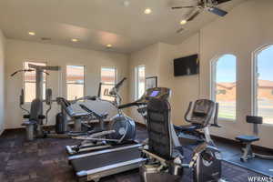 Gym with recessed lighting, a ceiling fan, visible vents, and a wealth of natural light