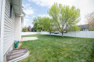 View of yard with a patio and a fenced backyard