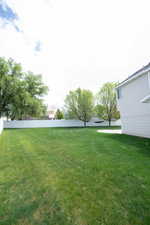 View of yard featuring fence
