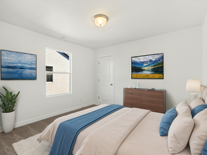 Carpeted bedroom with visible vents and baseboards
