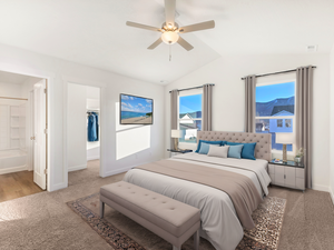 Bedroom with baseboards, ensuite bath, light carpet, a walk in closet, and lofted ceiling