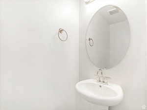 Bathroom with visible vents and a sink