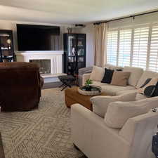 Living room with a glass covered fireplace