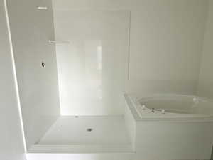 Full bathroom with a garden tub
