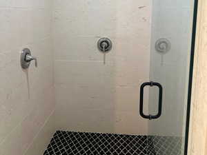 Full bathroom featuring a stall shower