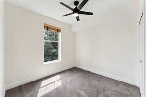 Bedroom 2  with ceiling fan, and carpet floors
